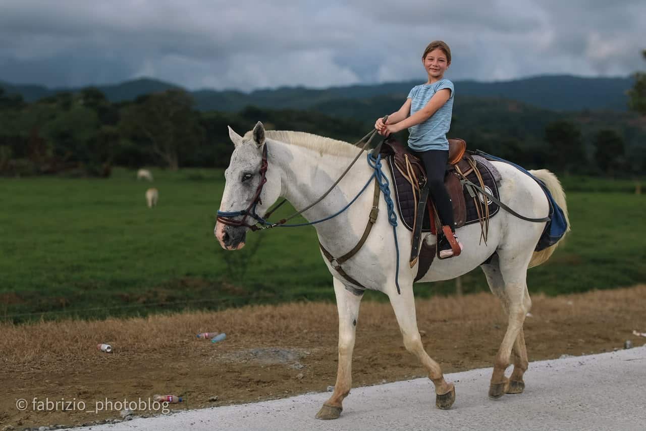 Horseback riders exploring countryside trails near Jacó, Costa Rica